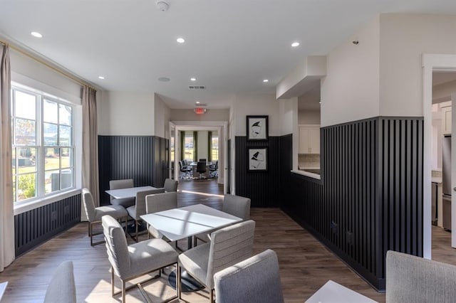 dining space with hardwood / wood-style flooring