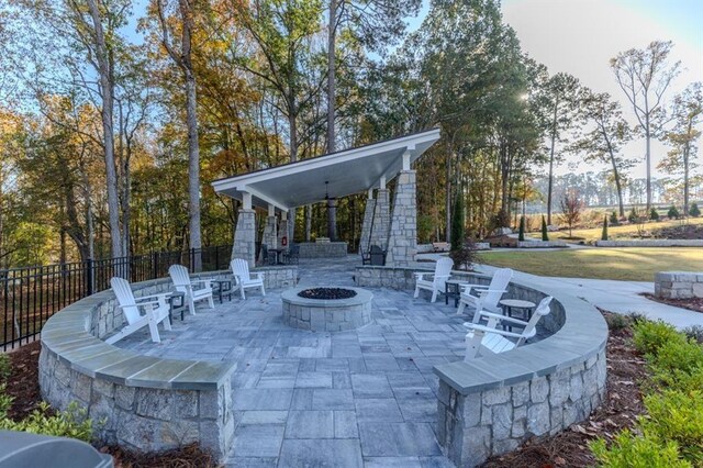 view of patio with an outdoor fire pit