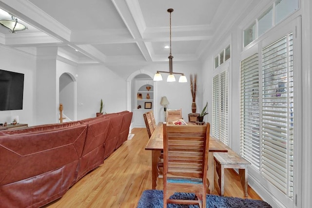 dining room featuring beam ceiling, coffered ceiling, crown molding, and hardwood / wood-style floors