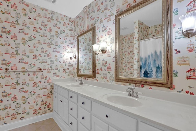 bathroom with tile patterned flooring and dual vanity