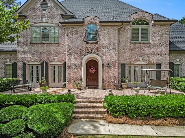 french provincial home with french doors