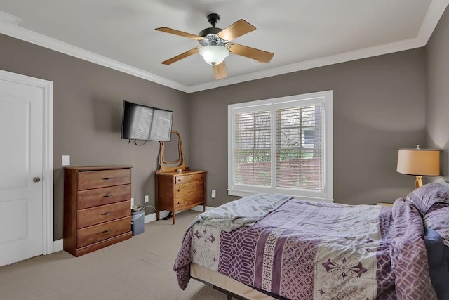 bedroom featuring carpet floors, ceiling fan, and crown molding