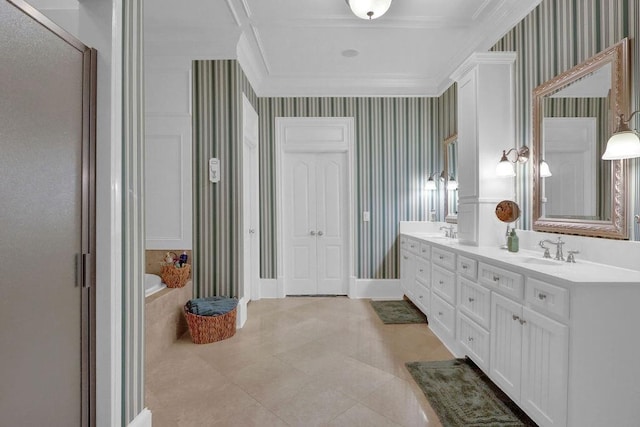 bathroom featuring ornamental molding, tile patterned floors, dual bowl vanity, and a relaxing tiled tub