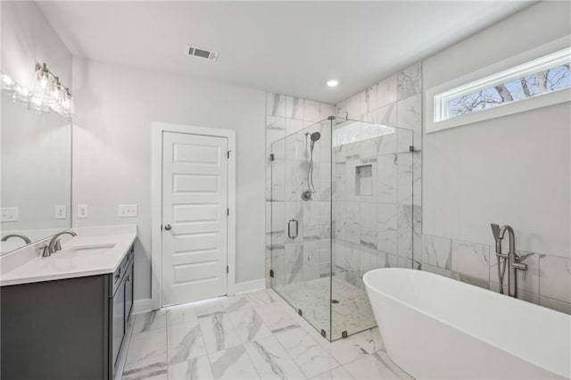 full bath featuring a marble finish shower, visible vents, a soaking tub, marble finish floor, and vanity