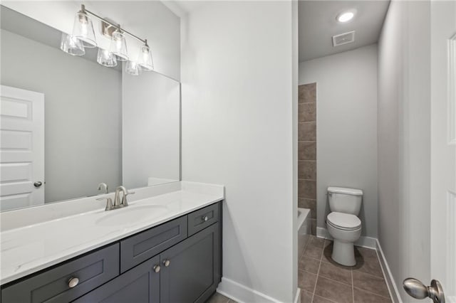 full bath featuring tile patterned floors, visible vents, toilet, baseboards, and vanity