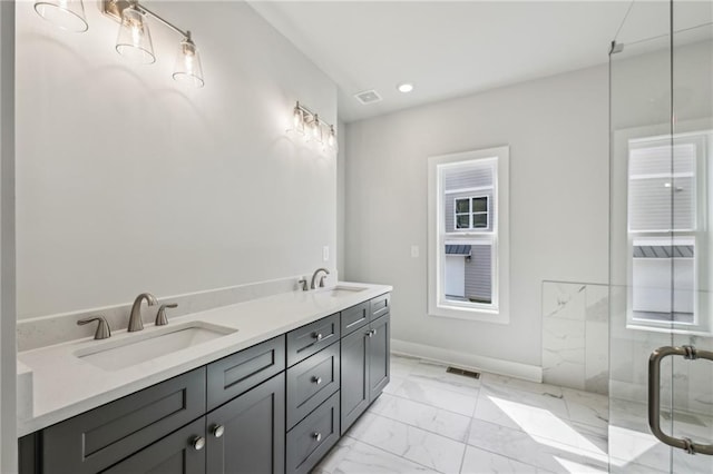 full bath with a sink, visible vents, and marble finish floor