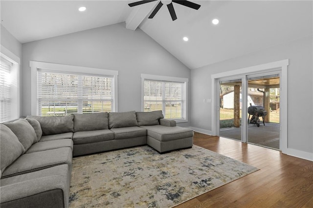 living room with beamed ceiling, high vaulted ceiling, wood finished floors, recessed lighting, and baseboards