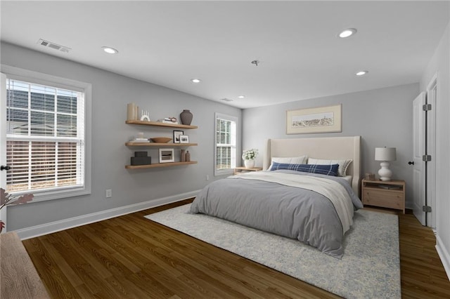 bedroom with visible vents, recessed lighting, baseboards, and wood finished floors