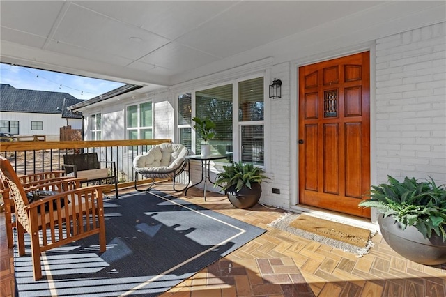 entrance to property with brick siding