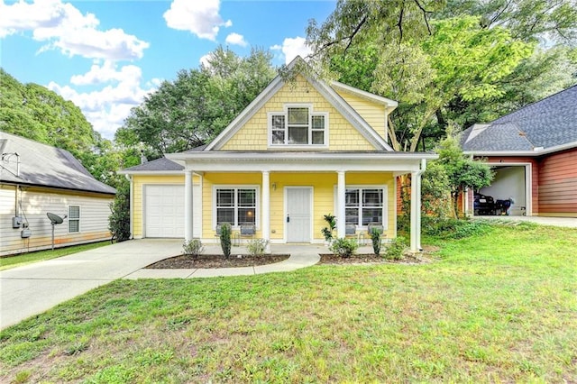 view of front of property with an attached garage, driveway, a front yard, and a porch