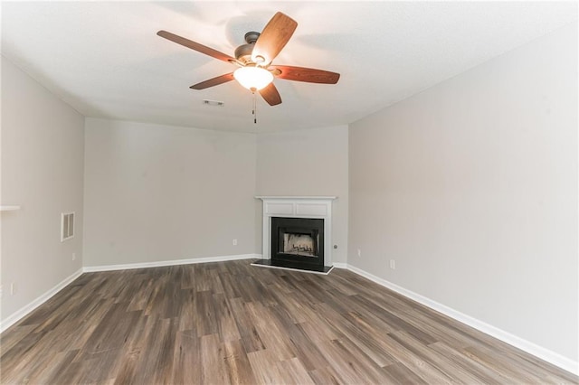 unfurnished living room featuring hardwood / wood-style floors and ceiling fan