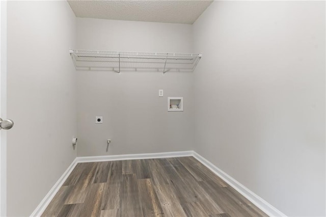 washroom featuring hookup for an electric dryer, hardwood / wood-style floors, washer hookup, and a textured ceiling