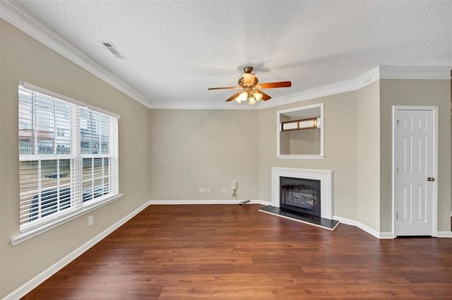 unfurnished living room with crown molding, dark hardwood / wood-style floors, a textured ceiling, and ceiling fan