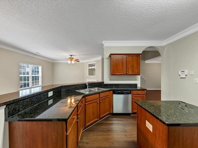 kitchen with dishwasher, sink, kitchen peninsula, and dark stone countertops