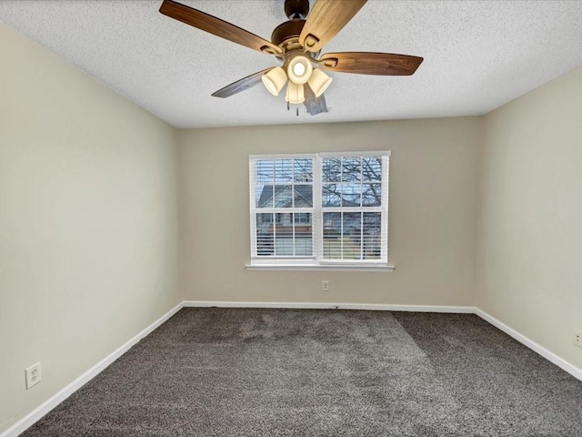 spare room featuring ceiling fan, carpet floors, and a textured ceiling