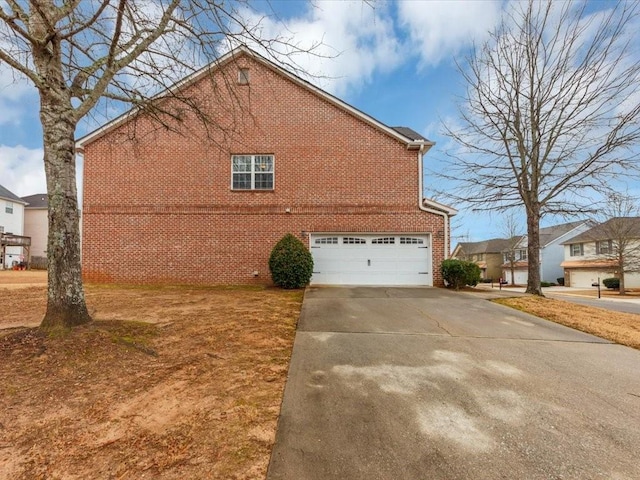 view of side of home with a garage