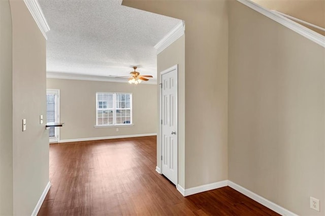 interior space with crown molding, dark hardwood / wood-style flooring, and a textured ceiling