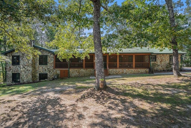 view of yard featuring a sunroom