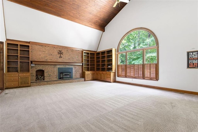 unfurnished living room featuring carpet floors, ceiling fan, high vaulted ceiling, and wooden ceiling