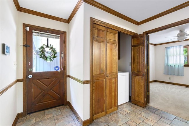 carpeted entrance foyer with washer / dryer, a wealth of natural light, and crown molding