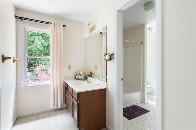 full bathroom with vanity, toilet, and shower / washtub combination