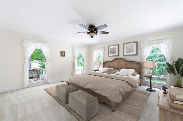 carpeted bedroom with access to outside and ceiling fan