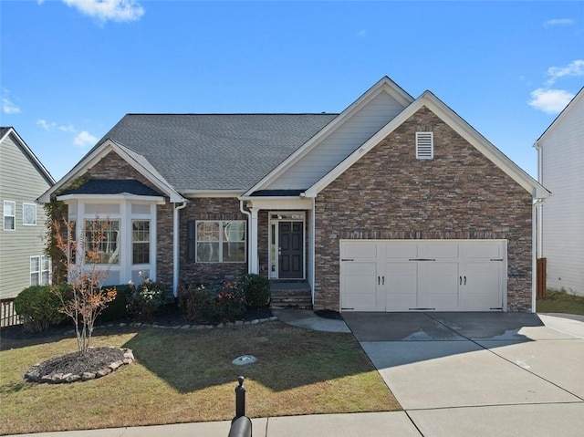 craftsman house with a garage and a front lawn