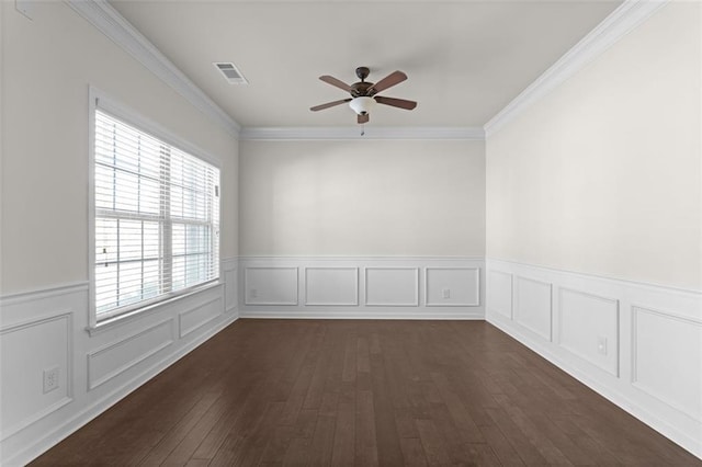 empty room featuring ornamental molding, dark hardwood / wood-style floors, and ceiling fan