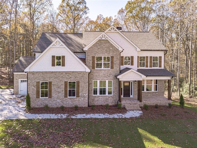 view of front of house with a garage and a front lawn