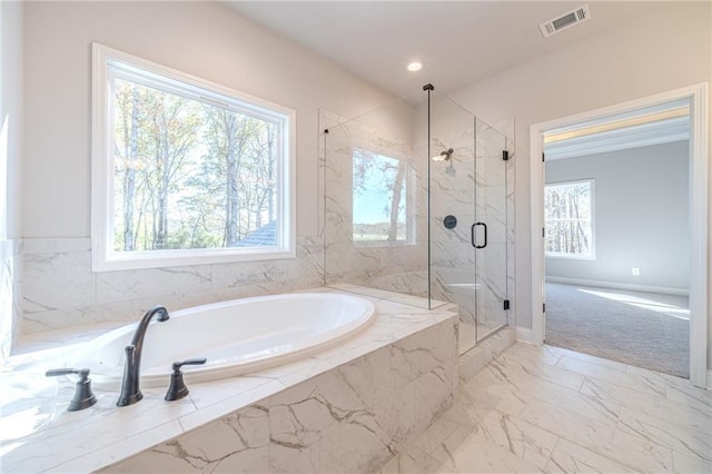 bathroom featuring plus walk in shower