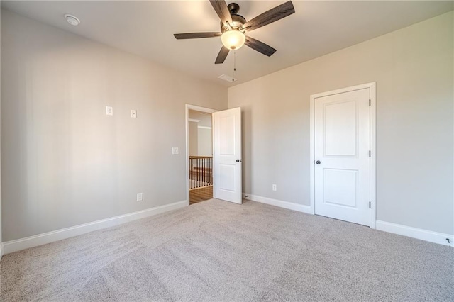 unfurnished bedroom featuring ceiling fan and carpet floors