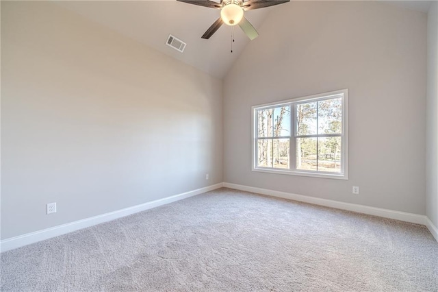 spare room with ceiling fan, carpet floors, and high vaulted ceiling