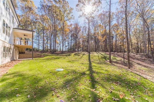 view of yard with ceiling fan