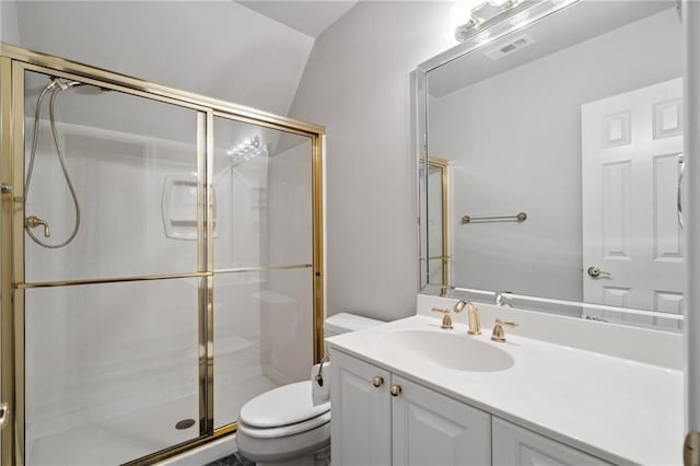 bathroom featuring visible vents, toilet, a stall shower, and vanity