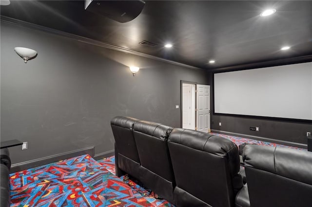 home theater room featuring recessed lighting, crown molding, and baseboards