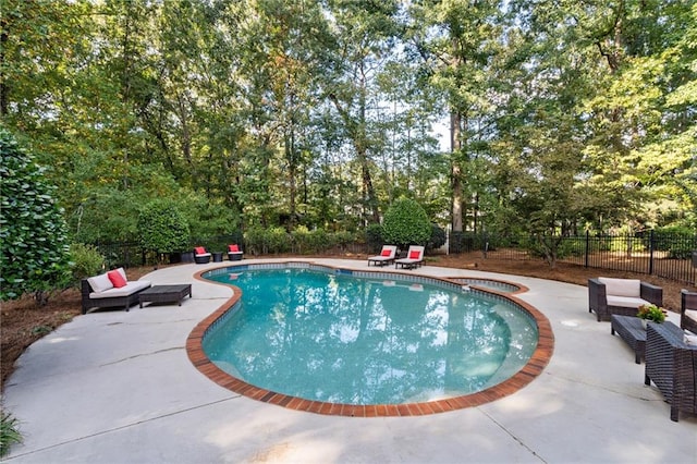 view of pool featuring a patio area, a fenced in pool, and a fenced backyard