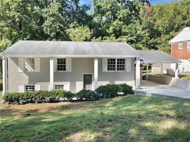 bi-level home with a front lawn