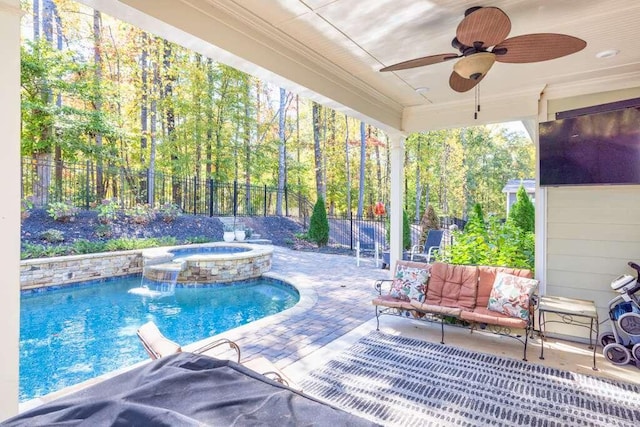 view of pool featuring a patio area, pool water feature, an in ground hot tub, and ceiling fan