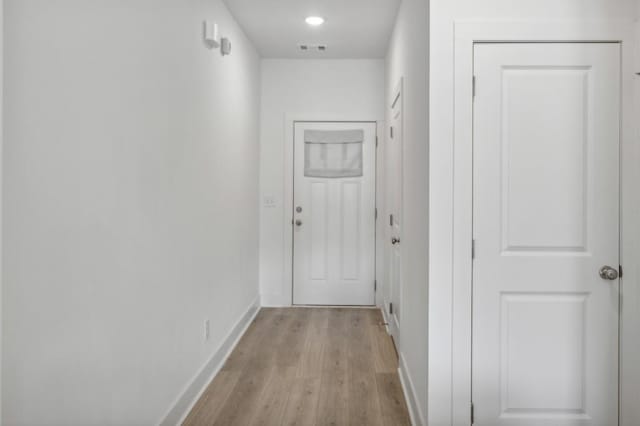 hallway with light wood-type flooring