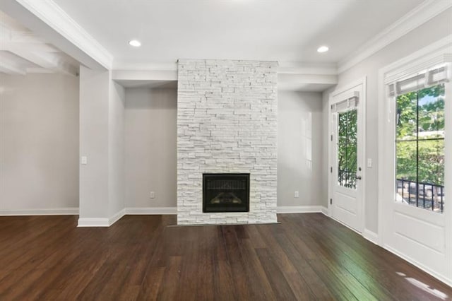 unfurnished living room with recessed lighting, a fireplace, wood finished floors, and baseboards