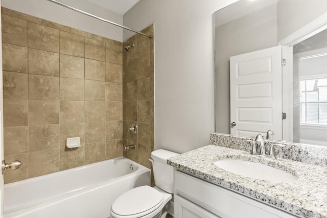 full bathroom featuring bathtub / shower combination, vanity, and toilet