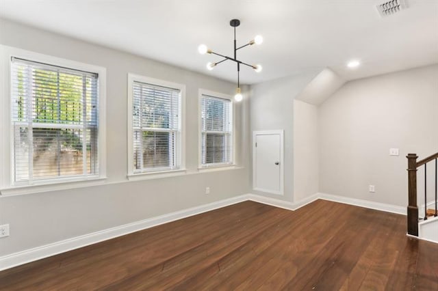 interior space featuring a healthy amount of sunlight, dark wood finished floors, stairway, and baseboards