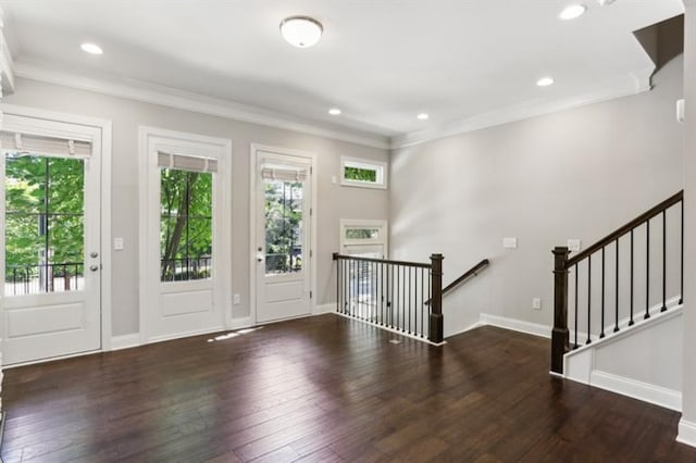 entrance foyer with baseboards, hardwood / wood-style floors, and crown molding