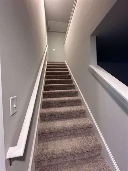 staircase with baseboards