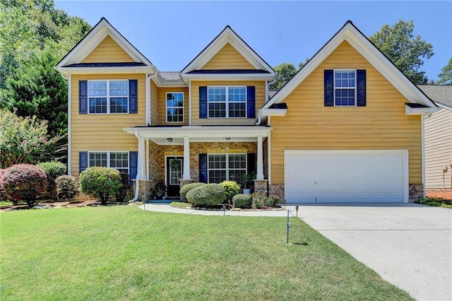 craftsman house featuring a front lawn and a garage