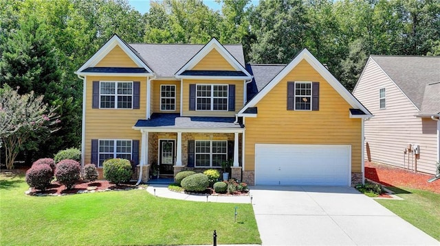 craftsman-style house featuring a garage and a front lawn