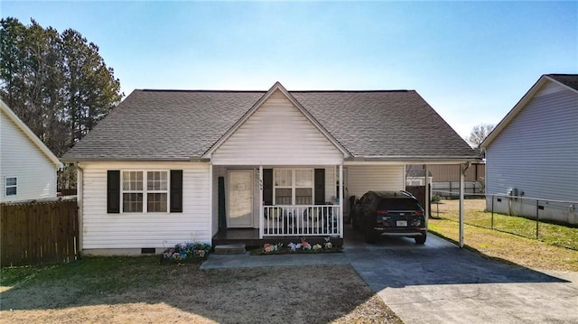 bungalow-style house featuring a front lawn, a carport, and covered porch