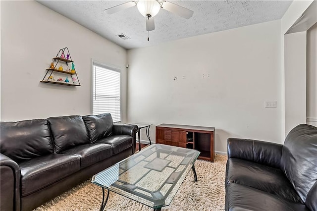 2555 Flat Shoals Rd Unit 2006, Atlanta, GA 30349 - living room with ceiling fan, a textured ceiling, and carpet floors