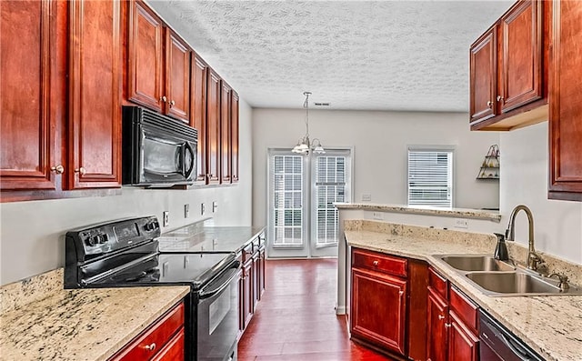 2555 Flat Shoals Rd Unit 2006, Atlanta, GA 30349 - kitchen featuring black appliances, dark brown cabinets, plenty of natural light, a textured ceiling, and dark wood-type flooring