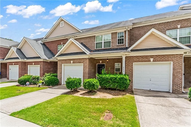 2555 Flat Shoals Rd Unit 2006, Atlanta, GA 30349 - multi unit property with brick siding, driveway, and a front yard